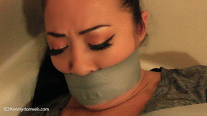 knottydamsels.com - Nyssa Nevers: Robbed & Taped In The Bathroom thumbnail